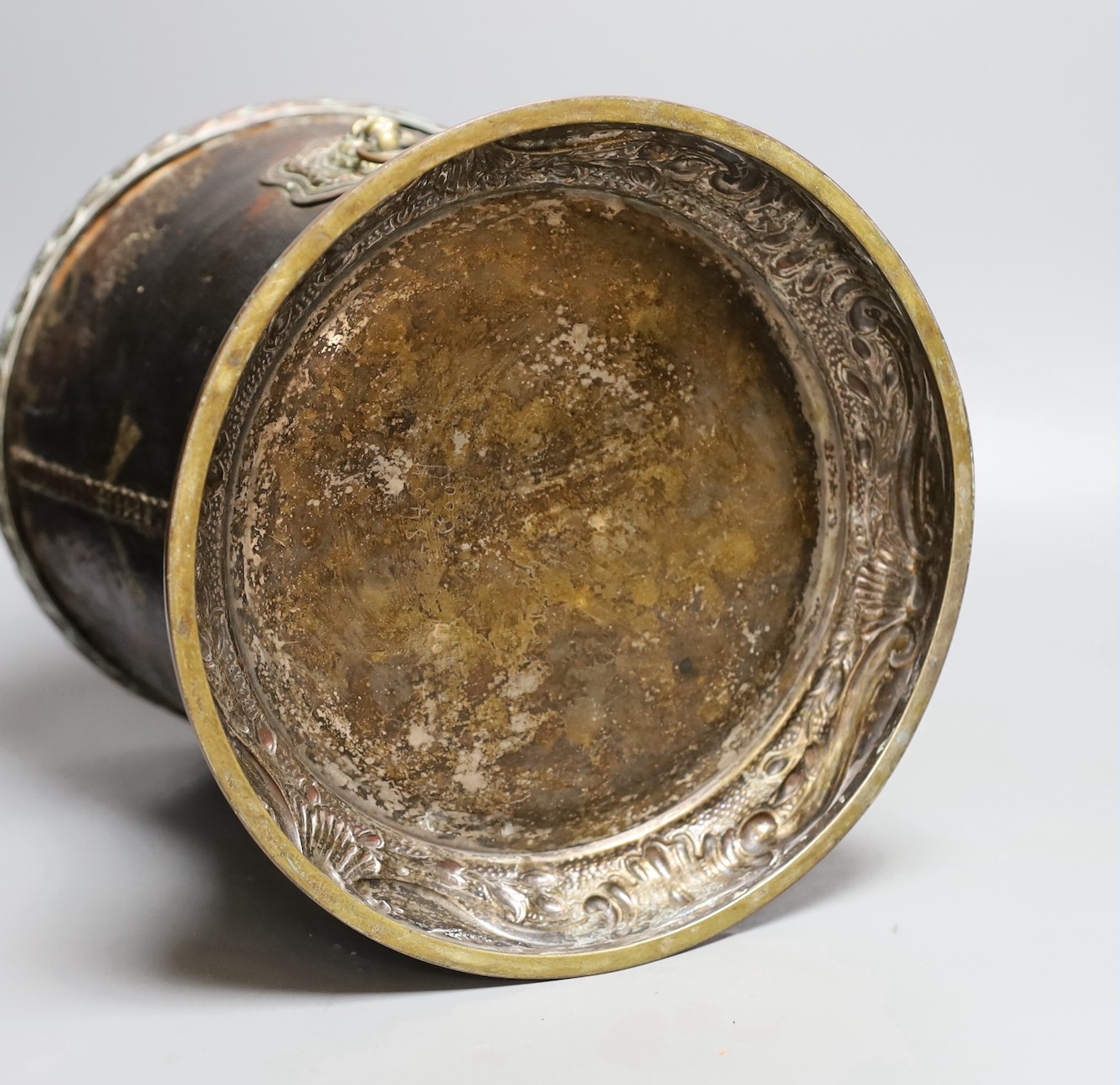 A George III leather fire bucket dated 1800, with later 19th century mounts, inscribed 'GR 1800 Pavilion' (cut down), 27cm tall